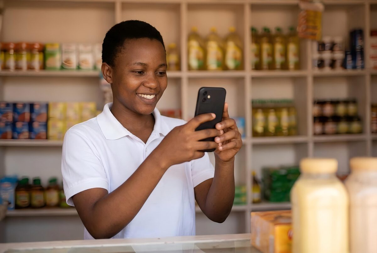 Small business owner photographing products in their shop to share on social media